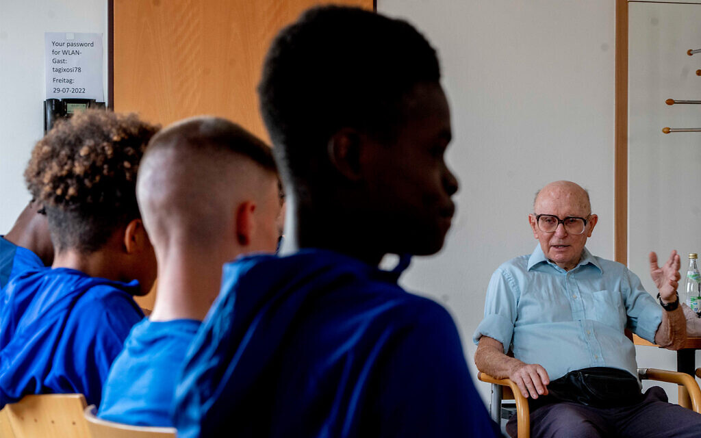 Holocaust survivor Shaul Paul Ladany talks to youth players of FC Chelsea in Nuremberg, Germany, July 29, 2022. (AP Photo/Michael Probst) Holocaust survivor Shaul Paul Ladany talks to youth players of FC Chelsea in Nuremberg, Germany, July 29, 2022. (AP Photo/Michael Probst)