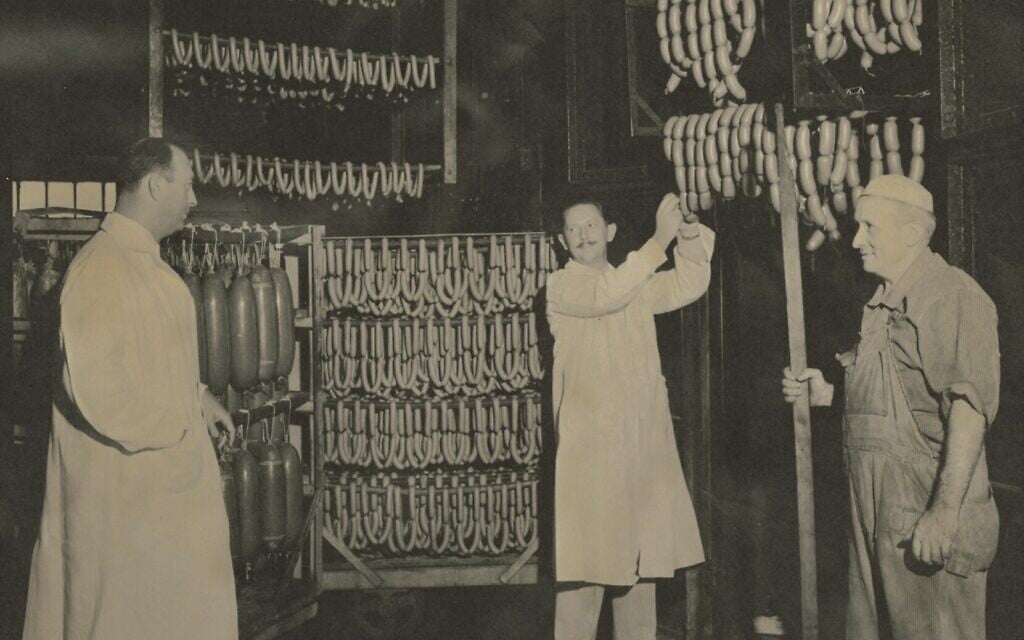 Inspecting sausages at the Vienna Beef factory in Chicago, circa 1950s. (Vienna Beef Museum/ Skirball Center)