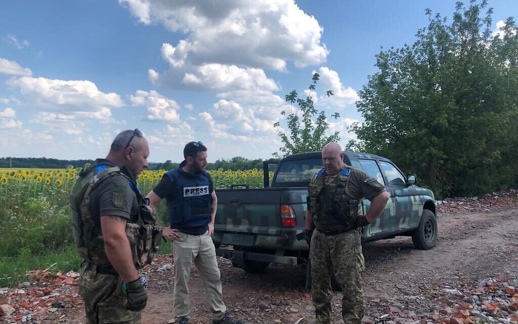 Oleksander (L) and Volodymyr (R), officers in the Territorial Defense Force's 128th Battalion, speak to The Times of Israel near Chuhuiv, July 28. 2022  (Lazar Berman/The Times of Israel)