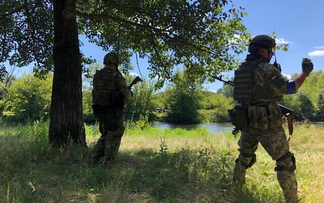 Ukrainian soldiers secure the bank of the Siverskyi Donets River near Zadonets'ke, July 29, 2022 (Lazar Berman/The Times of Israel)