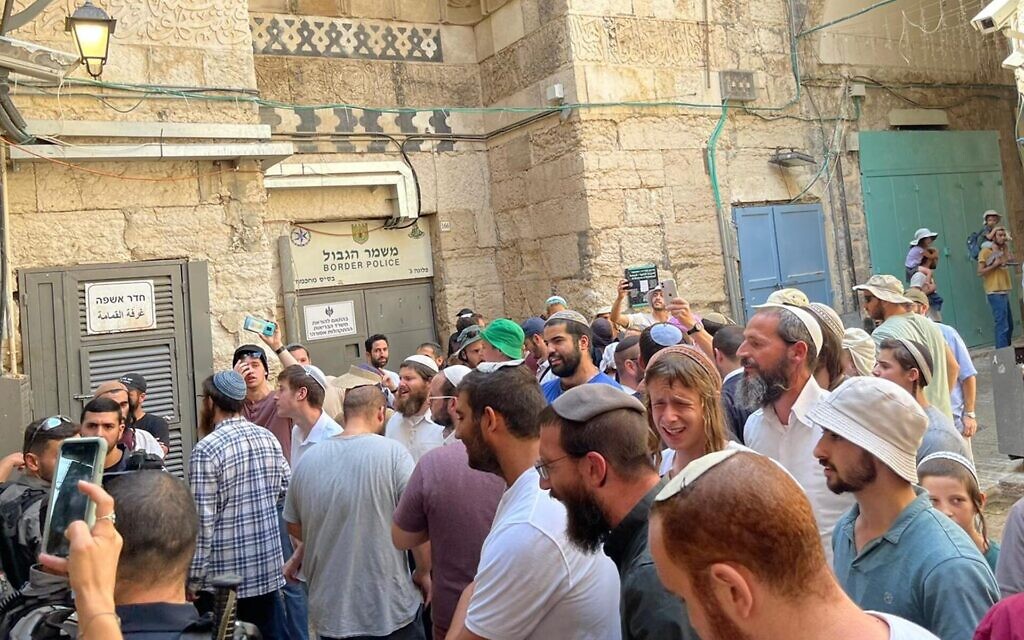 A group of Jewish men shouts the Shema prayer after leaving the Temple Mount, where prayer by non-Muslims is prohibited, August 7, 2022. (Ron Kampeas/JTA) A group of Jewish men shouts the Shema prayer after leaving the Temple Mount, where prayer by non-Muslims is prohibited, August 7, 2022. (Ron Kampeas/JTA)