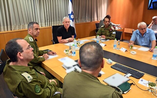 Defense Minister Beny Gantz (center) holds an assessment with military chief of staff Aviv Kohavi (right) and other officials at the IDF headquarters in Tel Aviv, August 8, 2022. (Defense Ministry) Defense Minister Beny Gantz (center) holds an assessment with military chief of staff Aviv Kohavi (right) and other officials at the IDF headquarters in Tel Aviv, August 8, 2022. (Defense Ministry)