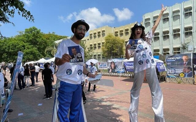 Performers on stilts welcome Likud primary voters in Rishon Lezion, August 10, 2022 (Carrie Keller-Lynn/Times of Israel) Performers on stilts welcome Likud primary voters in Rishon Lezion, August 10, 2022 (Carrie Keller-Lynn/Times of Israel)