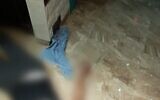 Muhammad Shaham is seen lying on the floor of his home next to a knife he allegedly used to attack Border Police officers with, August 15, 2022. (Israel Police)