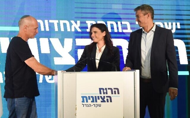 Amitai Porat (L) shakes hands with Zionist Spirit leaders Ayelet Shaked and Yoaz Hendel, Kfar Maccabiah, August 21, 2022. (Bernie Ardov / Benovitch Communications) Amitai Porat (L) shakes hands with Zionist Spirit leaders Ayelet Shaked and Yoaz Hendel, Kfar Maccabiah, August 21, 2022. (Bernie Ardov / Benovitch Communications)