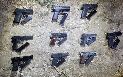 Weapons seized by security forces near Neve Ur in northern Israel, after an alleged gun-smuggling over the border with Jordan on August 21, 2022. (Israel Police)