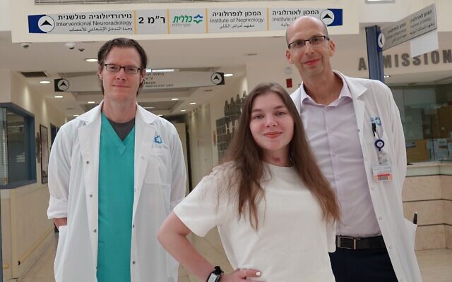 Anna Kosma (front), who has just entered rehab three months after doctors believed she had 2% chance of survival, pictured at Shaare Zedek Medical Center with her physicians Dr. Stefan Mausbach, left, and Dr. Roni Eichel (courtesy of Shaare Zedek Medical Center) Anna Kosma (front), who has just entered rehab three months after doctors believed she had 2% chance of survival, pictured at Shaare Zedek Medical Center with her physicians Dr. Stefan Mausbach, left, and Dr. Roni Eichel (courtesy of Shaare Zedek Medical Center)