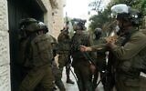 IDF soldiers carry out raids in the West Bank on August 18, 2022. (Israel Defense Forces)