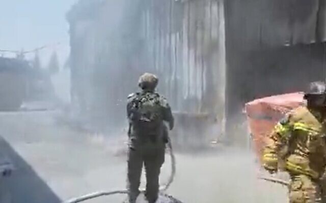 Firefighters work to extinguish blaze caused by rocket strike in southern border community, August 6, 2022 (Screen grab/Twitter) Firefighters work to extinguish blaze caused by rocket strike in southern border community, August 6, 2022 (Screen grab/Twitter)