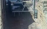 Security camera footage shows man attacking two people in parking dispute, August 18, 2022 (Screen grab/Israel Police)