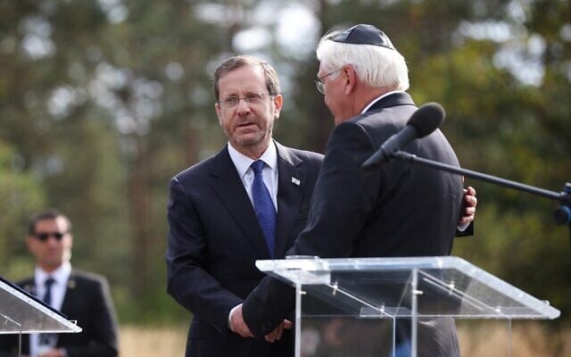 German President Frank-Walter Steinmeier (R) shakes hands wirth Israel's President Isaac Herzog during a visit to Bergen-Belsen Nazi concentration camp where thousands of prisoners from all over Europe were killed during World War II, in Bergen-Belsen near Nordhausen, central Germany, on September 6, 2022. (Ronny Hartmann/AFP) German President Frank-Walter Steinmeier (R) shakes hands wirth Israel's President Isaac Herzog during a visit to Bergen-Belsen Nazi concentration camp where thousands of prisoners from all over Europe were killed during World War II, in Bergen-Belsen near Nordhausen, central Germany, on September 6, 2022. (Ronny Hartmann/AFP)