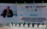 United Nation Special Envoy on Financing 2030 Agenda for Sustainable Development, Mahmoud Mohieldin of Egypt, is seen on screen as he talks during an African Ministers of Finance, Economy and Environment Meeting for the COP27 climate summit, in al-Masa hotel at the New Administrative Capital, some 45 kilometres east of Cairo, on September 7, 2022. (Khaled Desouki/AFP)