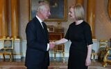 Britain's King Charles III (L) greets Britain's Prime Minister Liz Truss (R) during their first meeting at Buckingham Palace in London on September 9, 2022. (Yui Mok/Pool/AFP)