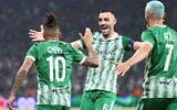 Maccabi Haifa's Surinamese midfielder Tjaronn Chery celebrates with teammates after scoring the opener during the UEFA Champions League group H football match between Israel's Maccabi Haifa and France's Paris Saint-Germain (PSG) at the Sammy Ofer stadium in the city of Haifa on September 14, 2022. (RONALDO SCHEMIDT / AFP)