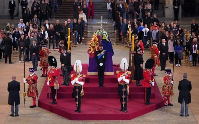 Queen Elizabeth II 's grandchildren (clockwise from front centre) Britain's Prince William, Prince of Wales, Peter Phillips, James, Viscount Severn, Britain's Princess Eugenie of York, Britain's Prince Harry, Duke of Sussex, Britain's Princess Beatrice of York, Britain's Lady Louise Windsor and Zara Tindall hold a vigil around the coffin of Queen Elizabeth II, draped in the Royal Standard with the Imperial State Crown and the Sovereign's orb and sceptre, lying in state on the catafalque in Westminster Hall, at the Palace of Westminster in London on September 16, 2022. (Aaron Chown/Pool/AFP) Queen Elizabeth II 's grandchildren (clockwise from front centre) Britain's Prince William, Prince of Wales, Peter Phillips, James, Viscount Severn, Britain's Princess Eugenie of York, Britain's Prince Harry, Duke of Sussex, Britain's Princess Beatrice of York, Britain's Lady Louise Windsor and Zara Tindall hold a vigil around the coffin of Queen Elizabeth II, draped in the Royal Standard with the Imperial State Crown and the Sovereign's orb and sceptre, lying in state on the catafalque in Westminster Hall, at the Palace of Westminster in London on September 16, 2022. (Aaron Chown/Pool/AFP)