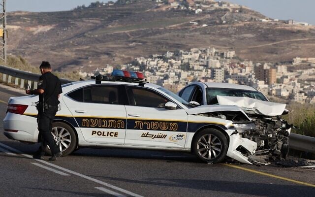 Damaged vehicles are seen at the scene of a suspected car-ramming attack near the West Bank outpost of Havat Gilad, September 24, 2022. (AHMAD GHARABLI / AFP) Damaged vehicles are seen at the scene of a suspected car-ramming attack near the West Bank outpost of Havat Gilad, September 24, 2022. (AHMAD GHARABLI / AFP)