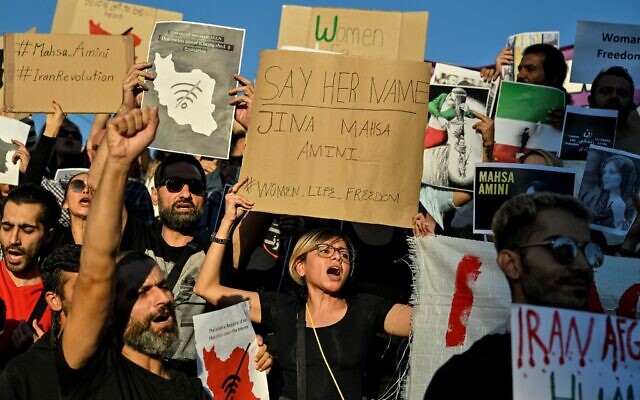 Iranians living in Greece chant slogans and hold placards during a demonstration in central Athens on September 24, 2022, following the death of an Iranian woman after her arrest by the country's morality police in Tehran. (Louisa Gouliamaki/AFP) Iranians living in Greece chant slogans and hold placards during a demonstration in central Athens on September 24, 2022, following the death of an Iranian woman after her arrest by the country's morality police in Tehran. (Louisa Gouliamaki/AFP)