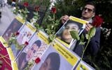 Sympathizers of the National Council of Resistance of Iran (NCRI) and of the People's Mujahedin of Iran (MEK) take part in a demonstration in support of Iranian protesters near the Iranian Embassy in Vienna, Austria on September 26, 2022. (Joe Klamar/AFP)