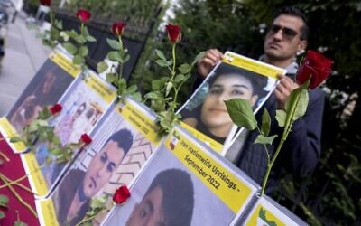 Sympathizers of the National Council of Resistance of Iran (NCRI) and of the People's Mujahedin of Iran (MEK) take part in a demonstration in support of Iranian protesters near the Iranian Embassy in Vienna, Austria on September 26, 2022. (Joe Klamar/AFP)