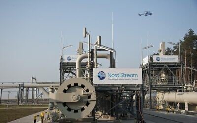 This file photo taken on November 8, 2011 shows a helicopter flying over the Nord Stream 1 gas pipeline terminal (John MACDOUGALL / AFP)