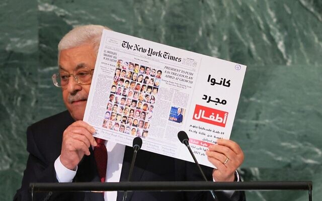 Palestinian Authority President Mahmoud Abbas holds up a New York Times front page showing children killed in the May 2021 Israel-Hamas conflict as he addresses the 77th session of the United Nations General Assembly in New York on September 23, 2022 (Michael M. Santiago/Getty Images/AFP) Palestinian Authority President Mahmoud Abbas holds up a New York Times front page showing children killed in the May 2021 Israel-Hamas conflict as he addresses the 77th session of the United Nations General Assembly in New York on September 23, 2022 (Michael M. Santiago/Getty Images/AFP)
