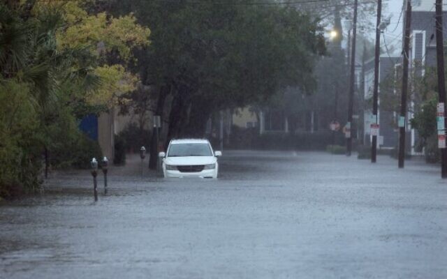 Rain from Hurricane Ian floods a street in Charleston, South Carolina, on September 30, 2022. (SCOTT OLSON/GETTY IMAGES NORTH AMERICA/Getty Images via AFP)
