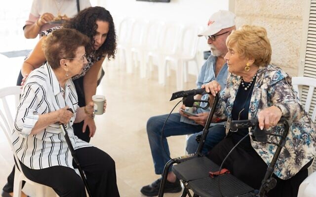 Illustrative: Holocaust survivors chat at the Yad Vashem Holocaust Remembrance Center during an event in which they were thanked for speaking to groups about their experiences, on September 19, 2022. (Yad Vashem) Illustrative: Holocaust survivors chat at the Yad Vashem Holocaust Remembrance Center during an event in which they were thanked for speaking to groups about their experiences, on September 19, 2022. (Yad Vashem)
