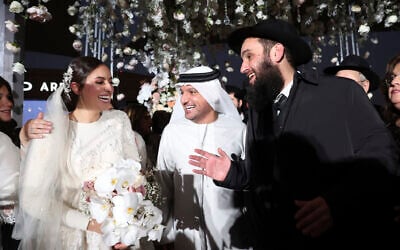 An Emirati government official, center, greets Lea Hadad, left, and UAE Rabbi Levi Duchman during their wedding in Abu Dhabi, UAE, Sept. 14, 2022. (Sami Sasso) An Emirati government official, center, greets Lea Hadad, left, and UAE Rabbi Levi Duchman during their wedding in Abu Dhabi, UAE, Sept. 14, 2022. (Sami Sasso)
