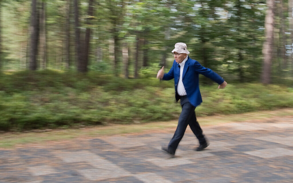Shaul Ladany walking at the Bergen-Belsen concentration camp memorial in 2019. (Julian Stratenschulte/picture alliance via Getty Images/ via JTA)
