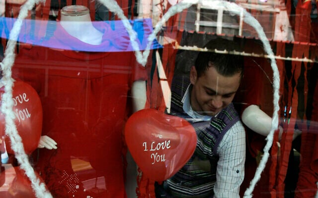 A Palestinian vendor is seen inside his shop decorated for Valentine's Day, in the West Bank city of Nablus, Feb. 14, 2011. (AP Photo/Nasser Ishtayeh) A Palestinian vendor is seen inside his shop decorated for Valentine's Day, in the West Bank city of Nablus, Feb. 14, 2011. (AP Photo/Nasser Ishtayeh)
