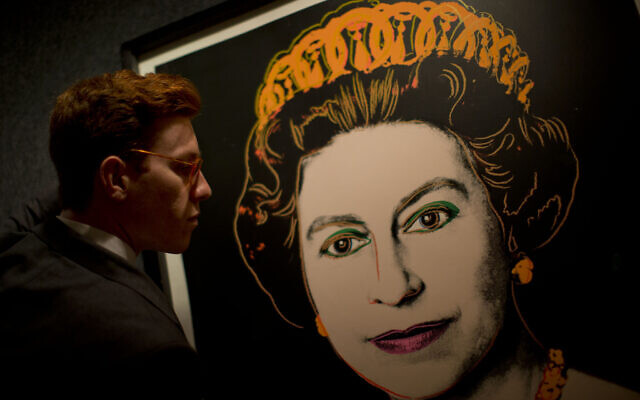 Bonhams employee George Foren poses for photographs with a rare trial proof copy of Andy Warhol's 1985 portrait of Britain's Queen Elizabeth II, at the auction house's offices in central London, Monday, July 9, 2012. (AP Photo/Matt Dunham) Bonhams employee George Foren poses for photographs with a rare trial proof copy of Andy Warhol's 1985 portrait of Britain's Queen Elizabeth II, at the auction house's offices in central London, Monday, July 9, 2012. (AP Photo/Matt Dunham)