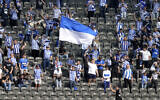 Berlin fans cheer prior to the German Bundesliga soccer match between Hertha BSC Berlin and VfL Wolfsburg in Berlin, Germany, Saturday, Aug. 21, 2021. (AP/Michael Sohn)