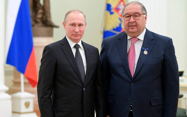 Russian President Vladimir Putin, left, poses for a photo with USM Holdings founder, businessman Alisher Usmanov during an awarding ceremony in Moscow's Kremlin, Russia, January 26, 2017. (Alexei Druzhinin/Sputnik, Kremlin Pool Photo via AP, File) Russian President Vladimir Putin, left, poses for a photo with USM Holdings founder, businessman Alisher Usmanov during an awarding ceremony in Moscow's Kremlin, Russia, January 26, 2017. (Alexei Druzhinin/Sputnik, Kremlin Pool Photo via AP, File)