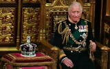 Prince Charles is seated next to the Queen's crown during the State Opening of Parliament, at the Palace of Westminster in London, May 10, 2022. (AP Photo/Alastair Grant, Pool, File)