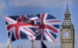 Union Jack flags are seen in front of the Elizabeth Tower, known as Big Ben, beside the Houses of Parliament in London, June 24, 2022 (AP Photo/Frank Augstein)
