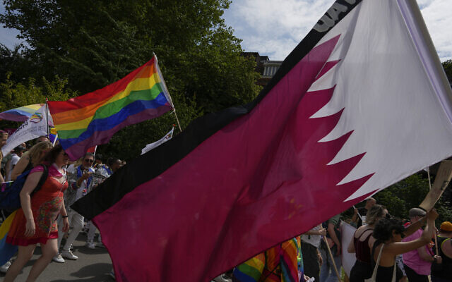 File: Demonstrators, some carrying the rianbow flag, pass the flag of Qatar and the flags of other countries where homosexuality is included in the penal code during a Pride Walk in Amsterdam, Netherlands, Saturday, July 30, 2022, calling for equal rights for members of the LGBT community (AP Photo/Peter Dejong) File: Demonstrators, some carrying the rianbow flag, pass the flag of Qatar and the flags of other countries where homosexuality is included in the penal code during a Pride Walk in Amsterdam, Netherlands, Saturday, July 30, 2022, calling for equal rights for members of the LGBT community (AP Photo/Peter Dejong)