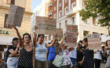 People stage a protest as right-wing party Brothers of Italy's leader Giorgia Meloni addresses a rally in Ancona, Italy, Aug. 23, 2022. (AP Photo/Domenico Stinellis)