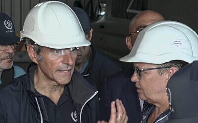 In this handout photo taken from video released by Russian Defense Ministry Press Service on September 2, 2022, International Atomic Energy Agency (IAEA) director Rafael Grossi, the mission leader, center, and IAEA members inspect the Zaporizhzhia Nuclear Power Plant in Enerhodar, southeastern Ukraine on September 1, 2022. (Russian Defense Ministry Press Service via AP)