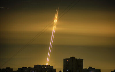 Russian rockets launched against Ukraine from Russia's Belgorod region are seen at dawn in Kharkiv, Ukraine, Sept. 3, 2022. (AP Photo/Vadim Belikov)