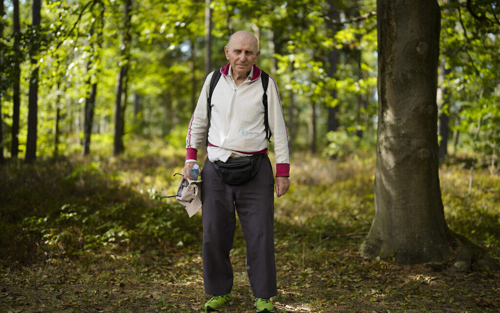 Israeli Olympic racewalker Shaul Ladany poses for a photo after an interview with The Associated Press at the former Nazi concentration camp Bergen-Belsen in Bergen, Germany, Sept. 3, 2022. (Markus Schreiber/AP)