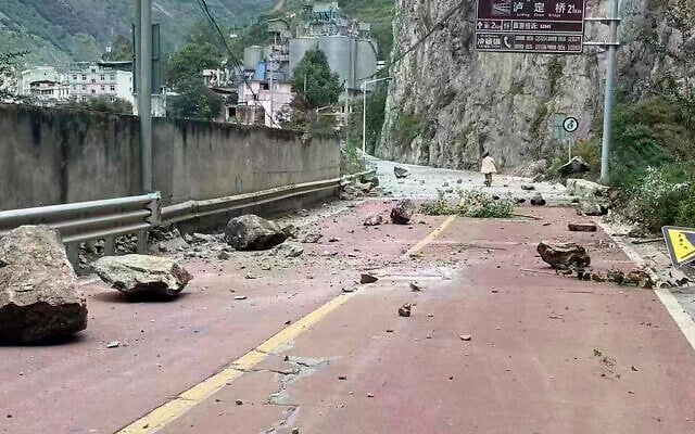 In this photo provided by China's Xinhua News Agency, fallen rocks are seen on a road near Lengqi Town in Luding County of southwest China's Sichuan Province Sept. 5, 2022. (Xinhua via AP) In this photo provided by China's Xinhua News Agency, fallen rocks are seen on a road near Lengqi Town in Luding County of southwest China's Sichuan Province Sept. 5, 2022. (Xinhua via AP)