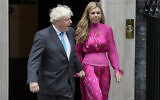 Outgoing British Prime Minister Boris Johnson arrives with his wife Carrie to speak outside Downing Street in London, September 6, 2022 before heading to Balmoral in Scotland, where he will announce his resignation to Britain's Queen Elizabeth II. (AP Photo/Frank Augstein)
