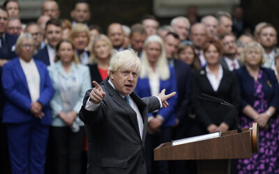 Outgoing British Prime Minister Boris Johnson speaks outside Downing Street in London, before heading to Balmoral in Scotland, where he formally announced his resignation to Britain's Queen Elizabeth II, Sept. 6, 2022. (Alberto Pezzali/AP)