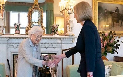 Britain's Queen Elizabeth II, left, welcomes Liz Truss during an audience at Balmoral, Scotland, where she invited the newly elected leader of the Conservative party to become Prime Minister and form a new government, September 6, 2022. (Jane Barlow/Pool Photo via AP)