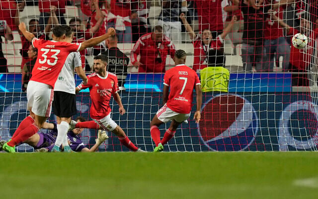 Benfica's Rafa Silva, center, celebrates after scoring his side's first goal during the Champions League group H soccer match between Benfica and Maccabi Haifa at the Luz stadium in Lisbon, Tuesday, Sept. 6, 2022. (AP/Armando Franca) Benfica's Rafa Silva, center, celebrates after scoring his side's first goal during the Champions League group H soccer match between Benfica and Maccabi Haifa at the Luz stadium in Lisbon, Tuesday, Sept. 6, 2022. (AP/Armando Franca)