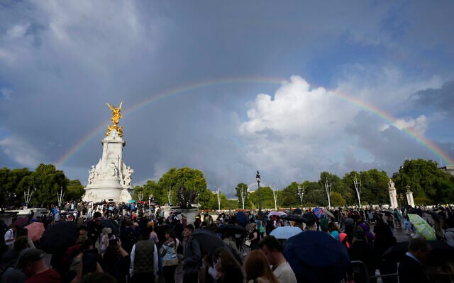 People gather outside Buckingham Palace in London as a double rainbow appears in the sky, Thursday, Sept. 8, 2022. (AP Photo/Frank Augstein) People gather outside Buckingham Palace in London as a double rainbow appears in the sky, Thursday, Sept. 8, 2022. (AP Photo/Frank Augstein)