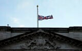 The Union flag on Buckingham Palace in London is lowered after the death of Britain's Queen Elizabeth II, September 8, 2022. (AP Photo/Frank Augstein)