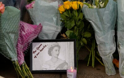 Raindrops are seen on a photograph left at the gates of Buckingham Palace by a mourner in London, September 9, 2022. (AP Photo/Kirsty Wigglesworth) Raindrops are seen on a photograph left at the gates of Buckingham Palace by a mourner in London, September 9, 2022. (AP Photo/Kirsty Wigglesworth)