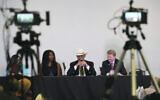 From left, Audrey Trujillo, candidate for New Mexico Secretary of State, Kristina Karamo, candidate for Michigan Secretary of State, Mark Finchem, candidate for Arizona Secretary of State and Jim Marchant, candidate for Nevada Secretary of State, attend a US conference on conspiracy theories about voting machines and discredited claims about the 2020 presidential election at a hotel in West Palm Beach, Florida, September 10, 2022. (AP Photo/Jim Rassol)