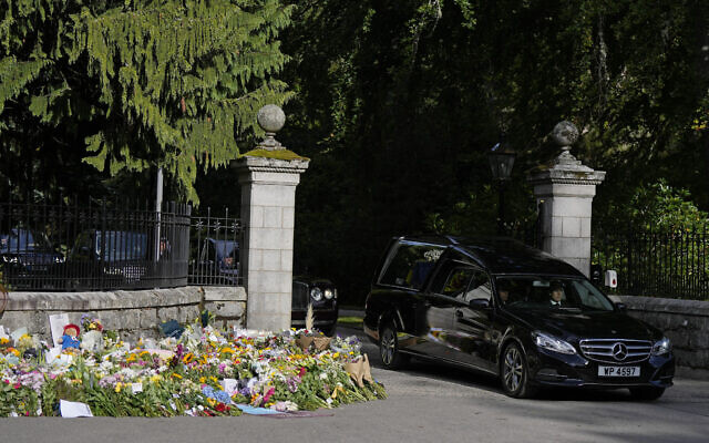 The coffin containing the body of Britain's Queen Elizabeth II leaves Balmoral Castle in Scotland, September 11, 2022. (Alastair Grant/AP)